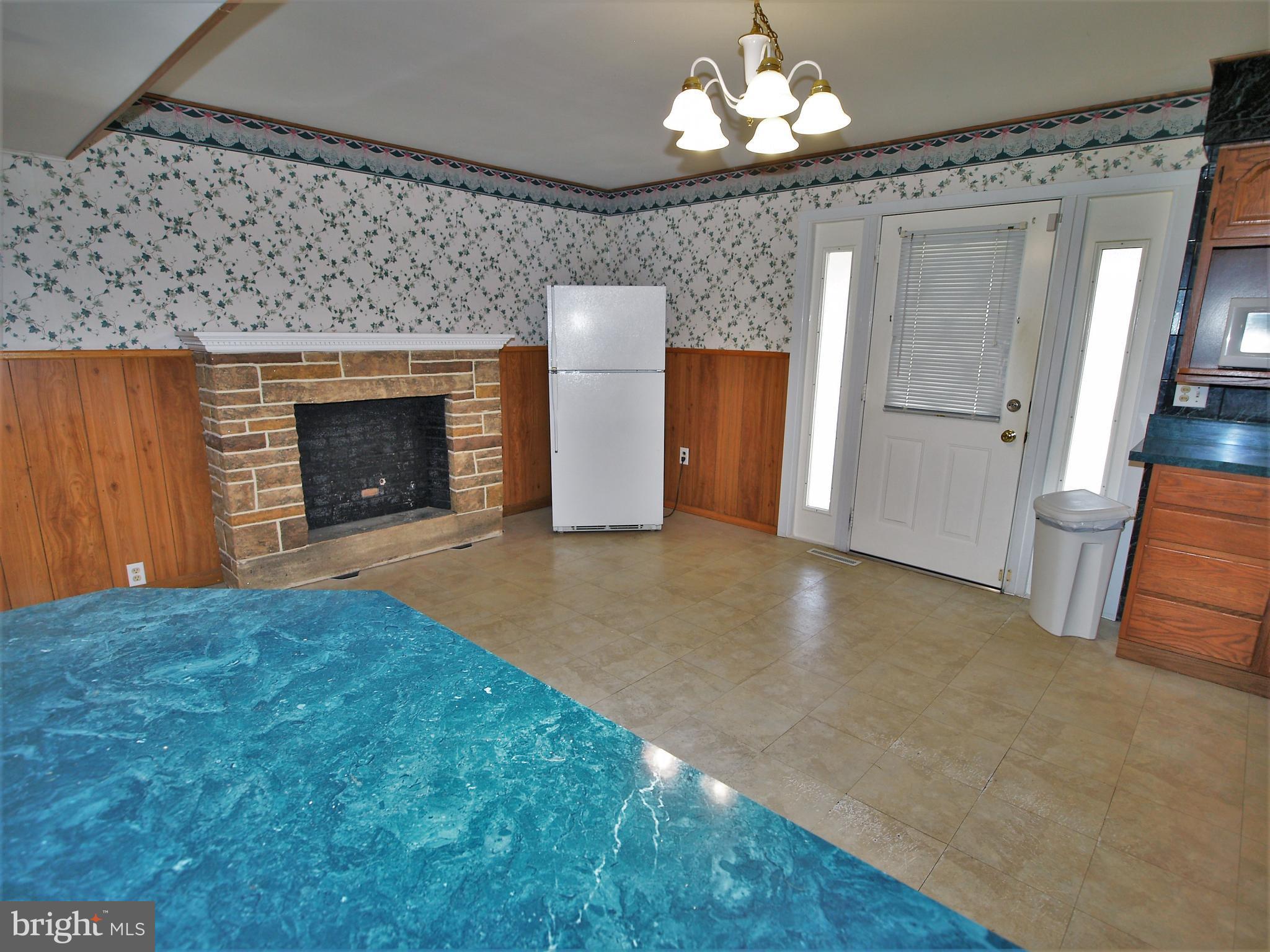 652 Charraway Road Baltimore, MD 21229 - Photo 10 of 22 a view of a livingroom with a fireplace