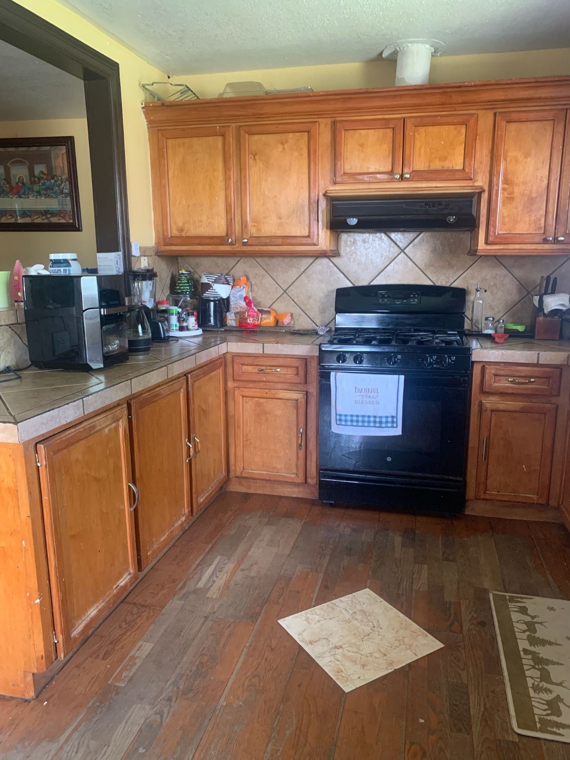 7311 Roswell Street Houston, TX 77022 - Photo 11 of 18 a kitchen with stainless steel appliances granite countertop a stove a sink and a microwave