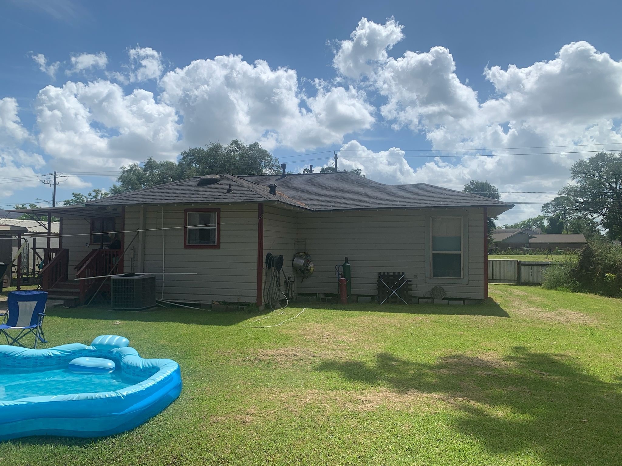 7311 Roswell Street Houston, TX 77022 - Photo 2 of 18 a view of a house with a yard