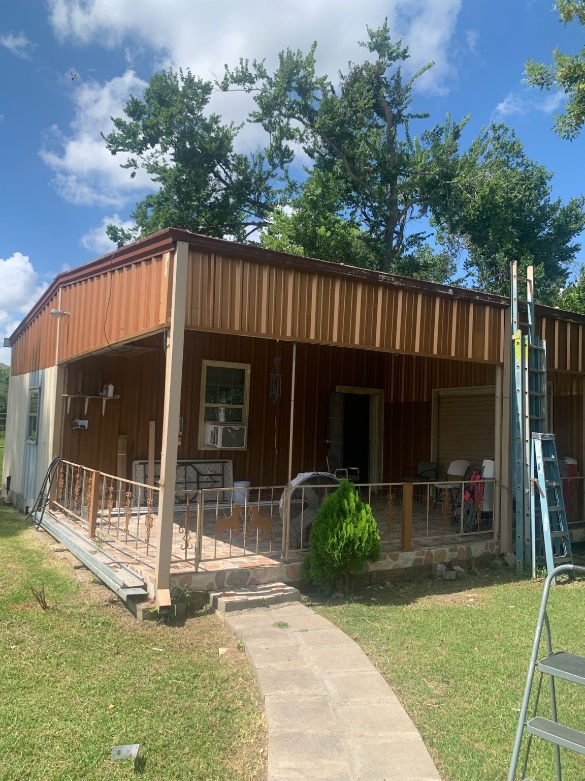 7311 Roswell Street Houston, TX 77022 - Photo 5 of 18 a view of a house with backyard porch and sitting area