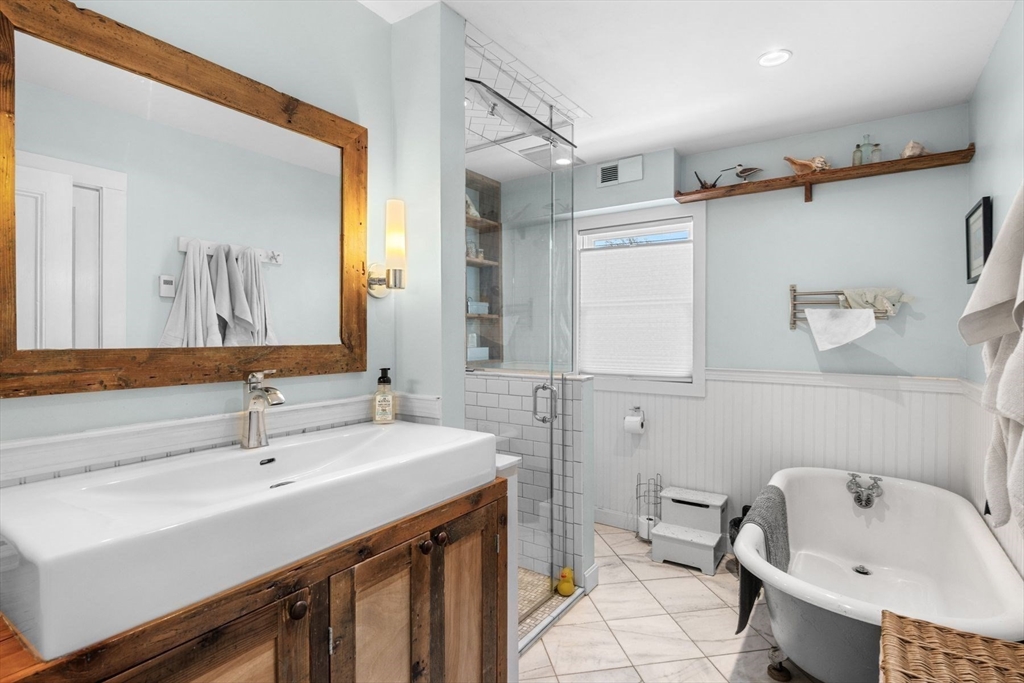 149 Elm Street Marblehead, MA 01945 - Photo 27 of 41 a bathroom with a sink and a mirror