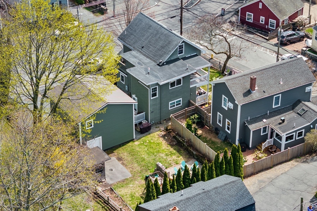 149 Elm Street Marblehead, MA 01945 - Photo 6 of 41 a aerial view of a house with a yard and potted plants