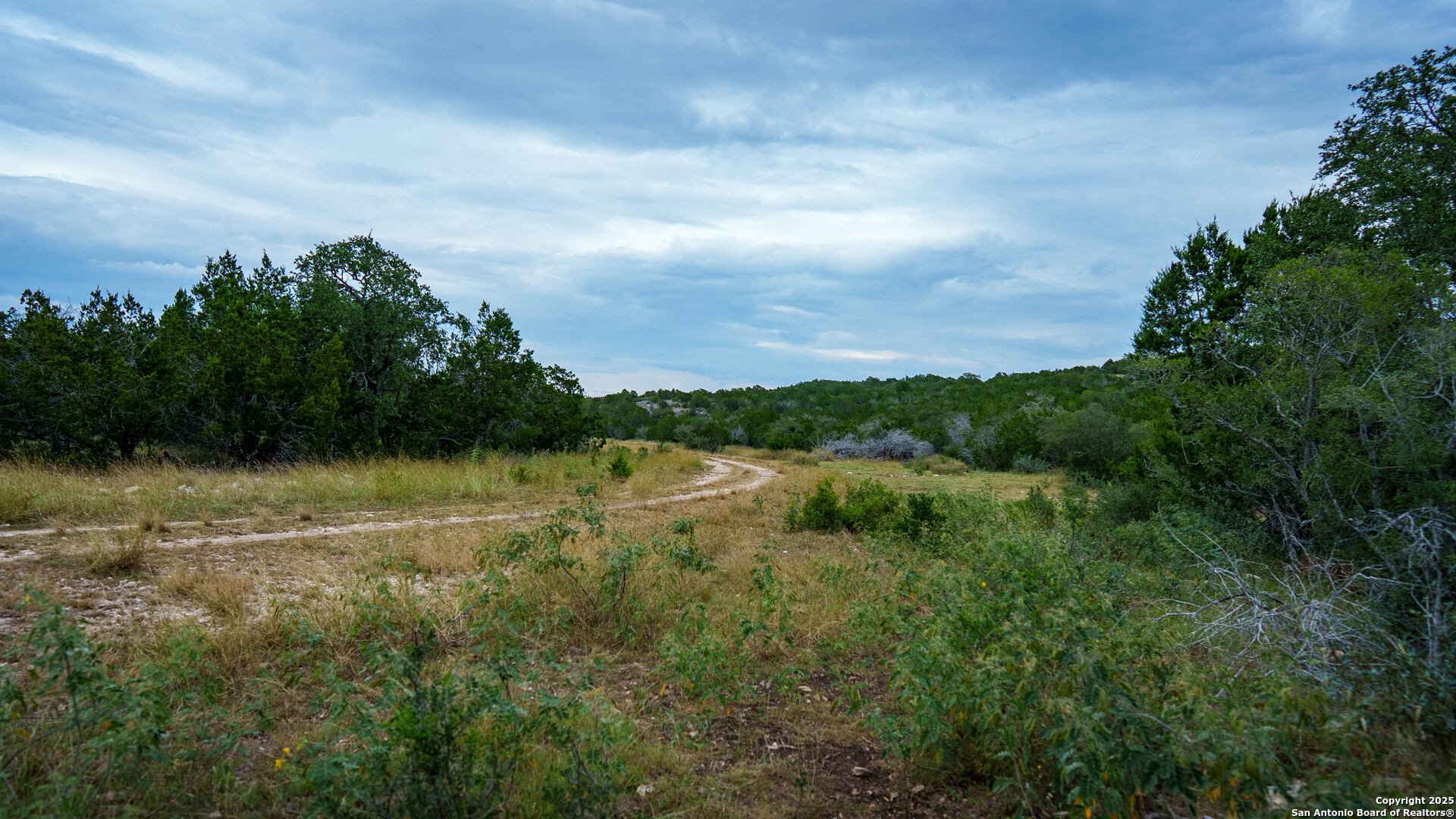 Tbd Tbd Rocksprings, TX 78880 - Photo 7 of 33 a view of lake with green space