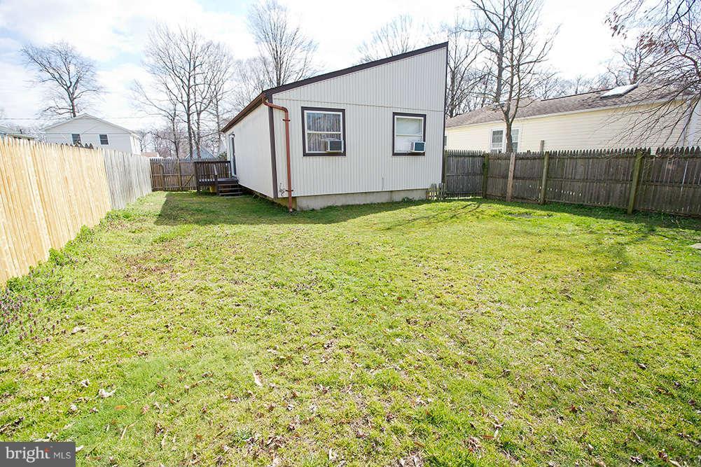 1634 Elkridge Drive Edgewater, MD 21037 - Photo 11 of 13 a view of a backyard with a large tree