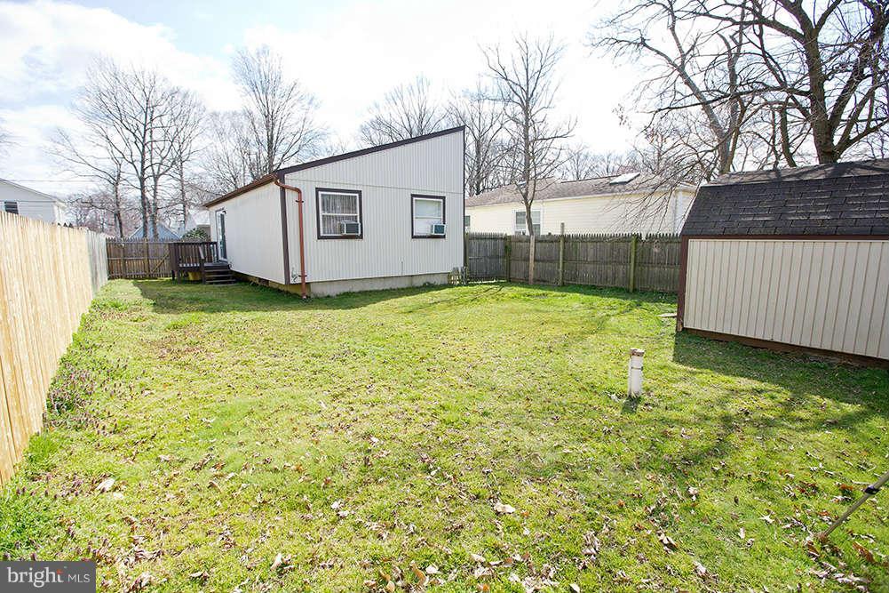 1634 Elkridge Drive Edgewater, MD 21037 - Photo 12 of 13 a view of a backyard with a large tree
