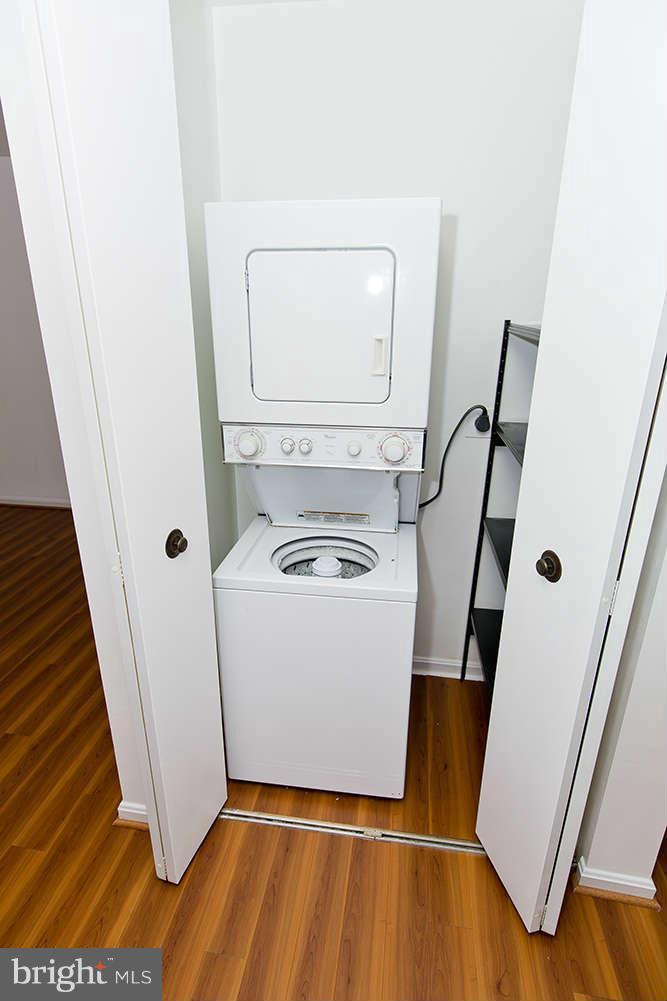 1634 Elkridge Drive Edgewater, MD 21037 - Photo 13 of 13 a view of washer and dryer with wooden floor