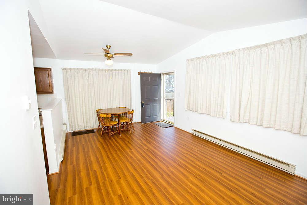 1634 Elkridge Drive Edgewater, MD 21037 - Photo 4 of 13 a living room with furniture and a table