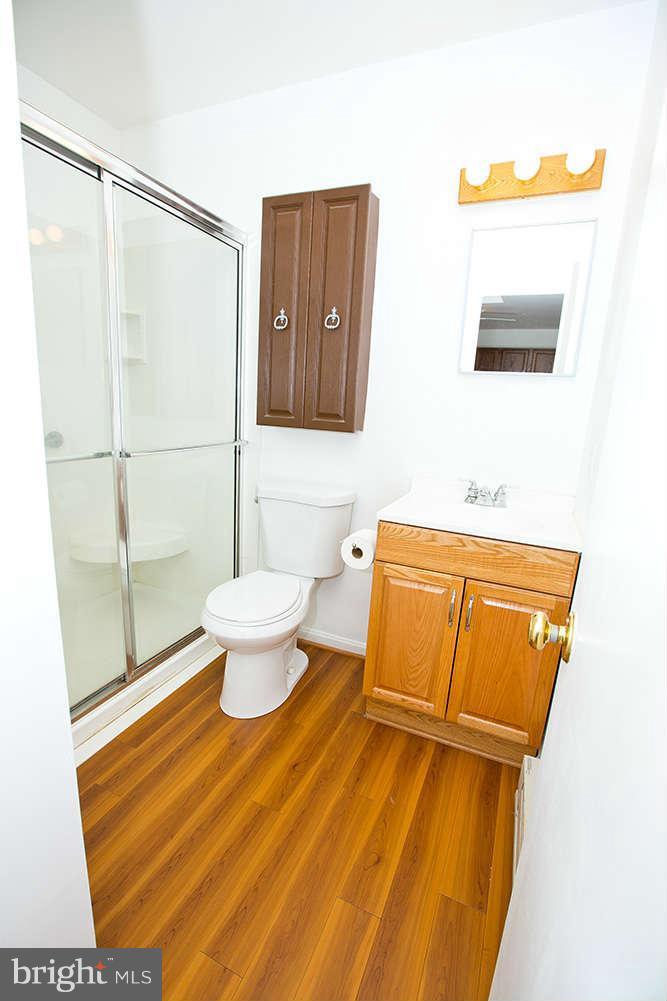 1634 Elkridge Drive Edgewater, MD 21037 - Photo 9 of 13 a bathroom with a toilet and a mirror