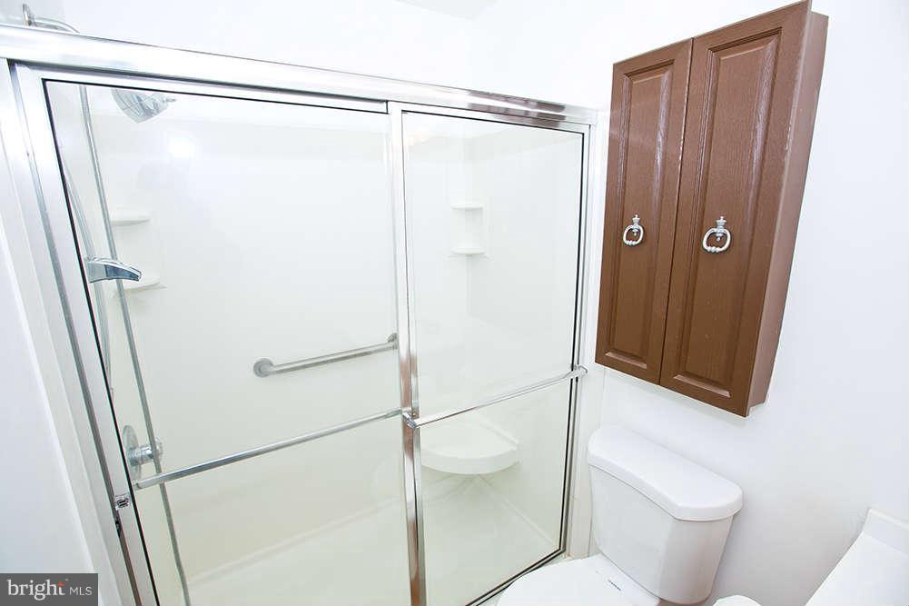 1634 Elkridge Drive Edgewater, MD 21037 - Photo 10 of 13 a bathroom with a shower and a toilet