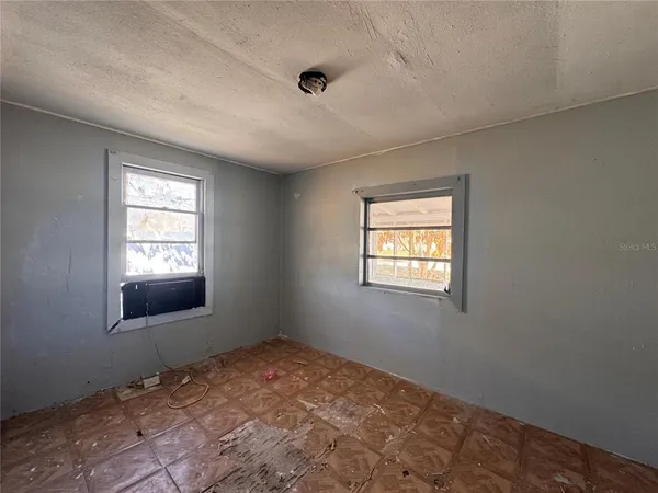 a view of an empty room and window