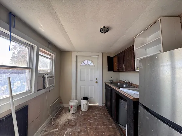a kitchen with a stove a refrigerator and a stove
