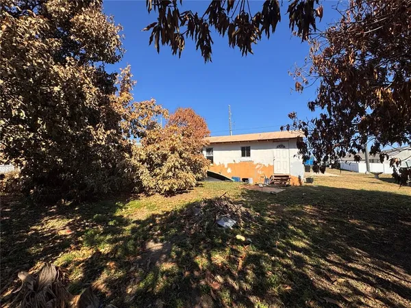 a view of a house with a tree