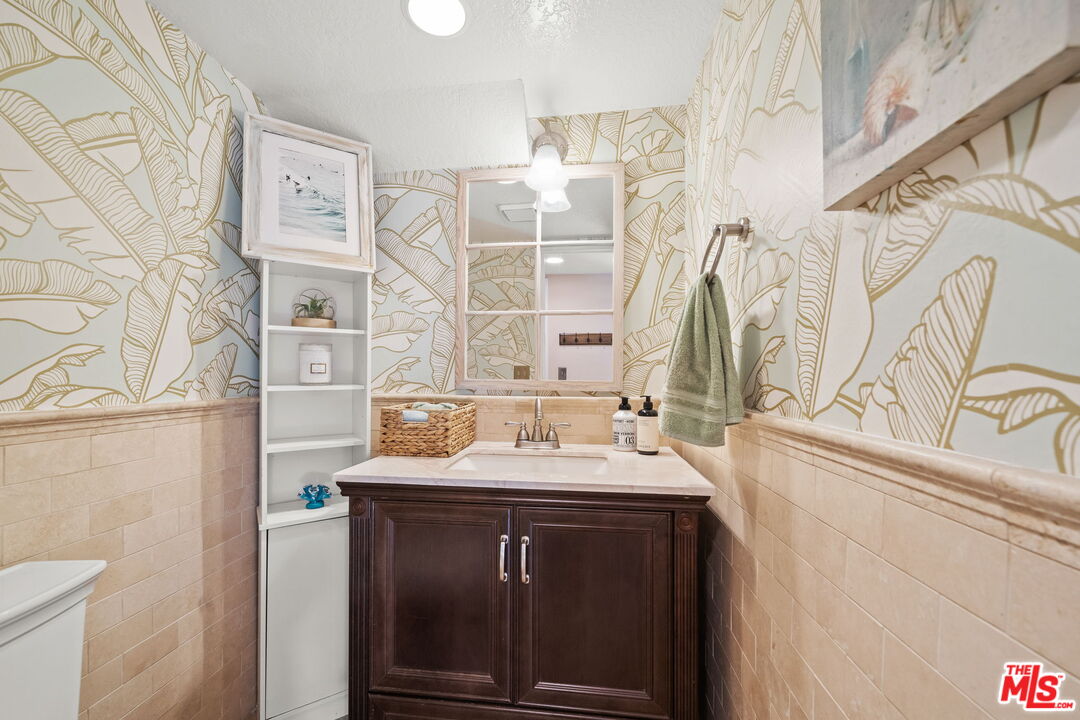 359 Termino Avenue Long Beach, CA 90814 - Photo 12 of 22 a bathroom with a sink and a mirror