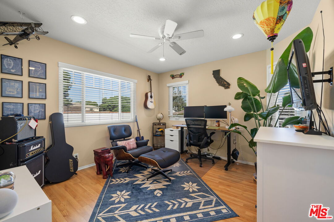 359 Termino Avenue Long Beach, CA 90814 - Photo 18 of 22 a living room with furniture a desk and chair with wooden floor