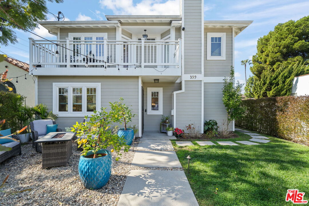 359 Termino Avenue Long Beach, CA 90814 - Photo 2 of 22 a front view of a house with a garden