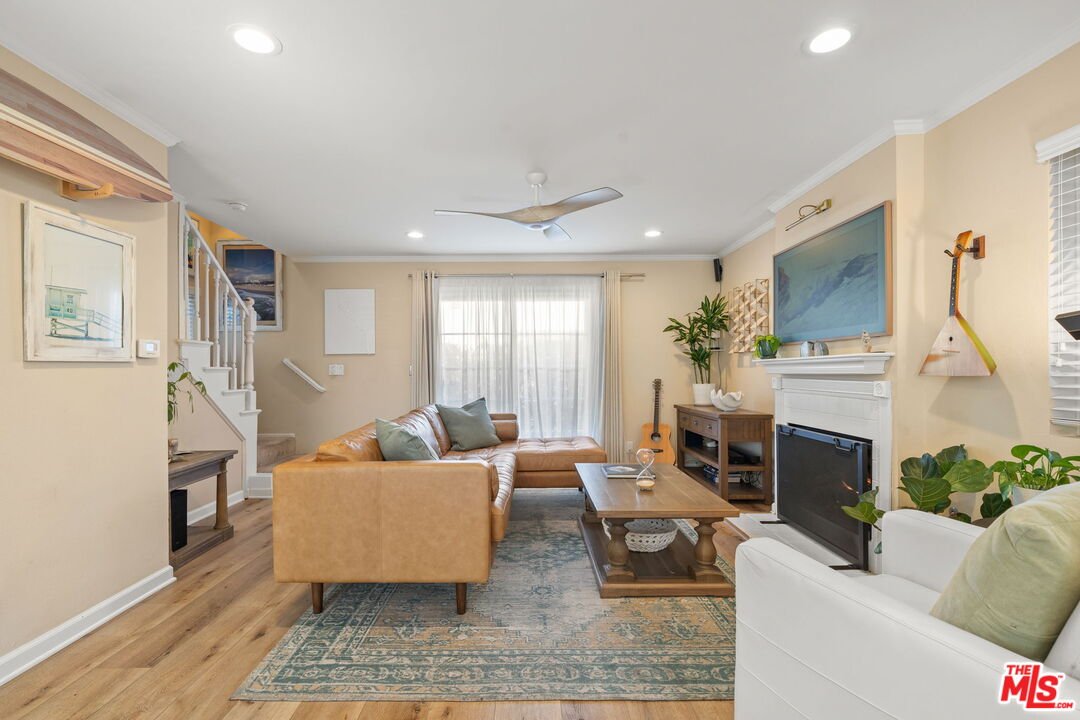 359 Termino Avenue Long Beach, CA 90814 - Photo 5 of 22 a living room with furniture and a fireplace
