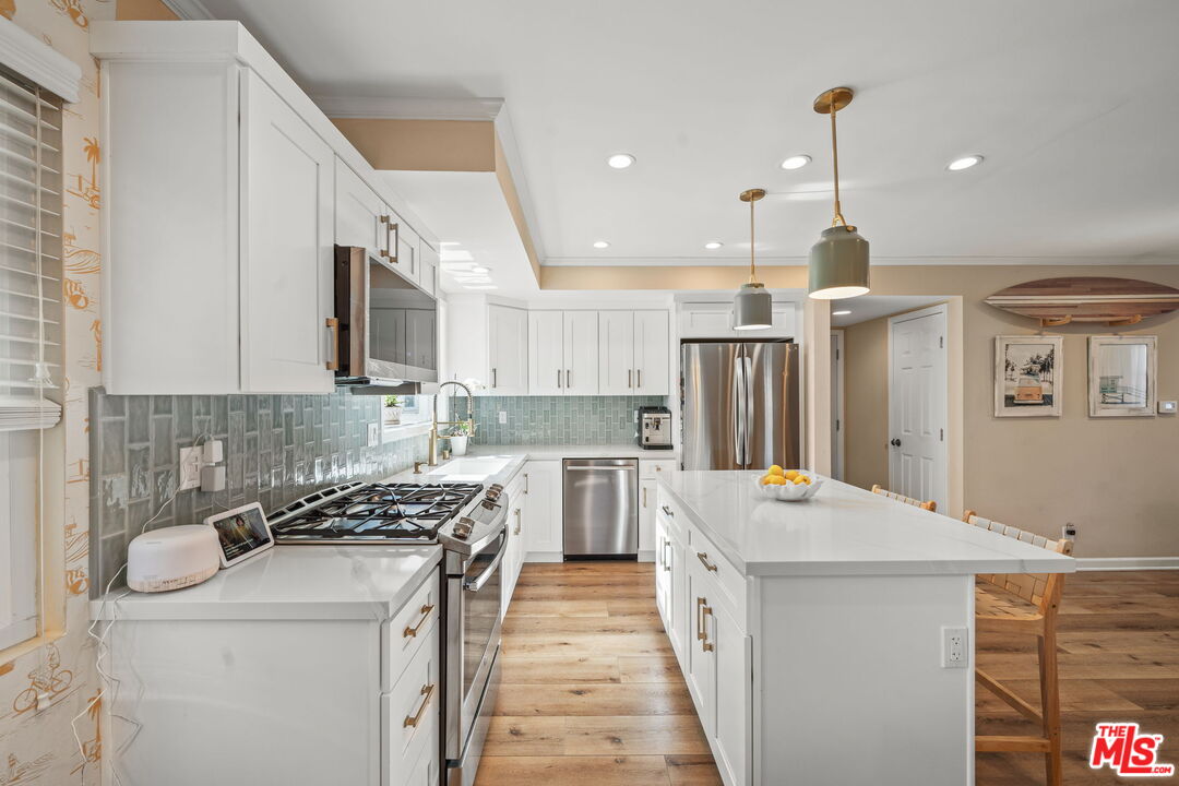 359 Termino Avenue Long Beach, CA 90814 - Photo 8 of 22 a kitchen with a sink stove and refrigerator