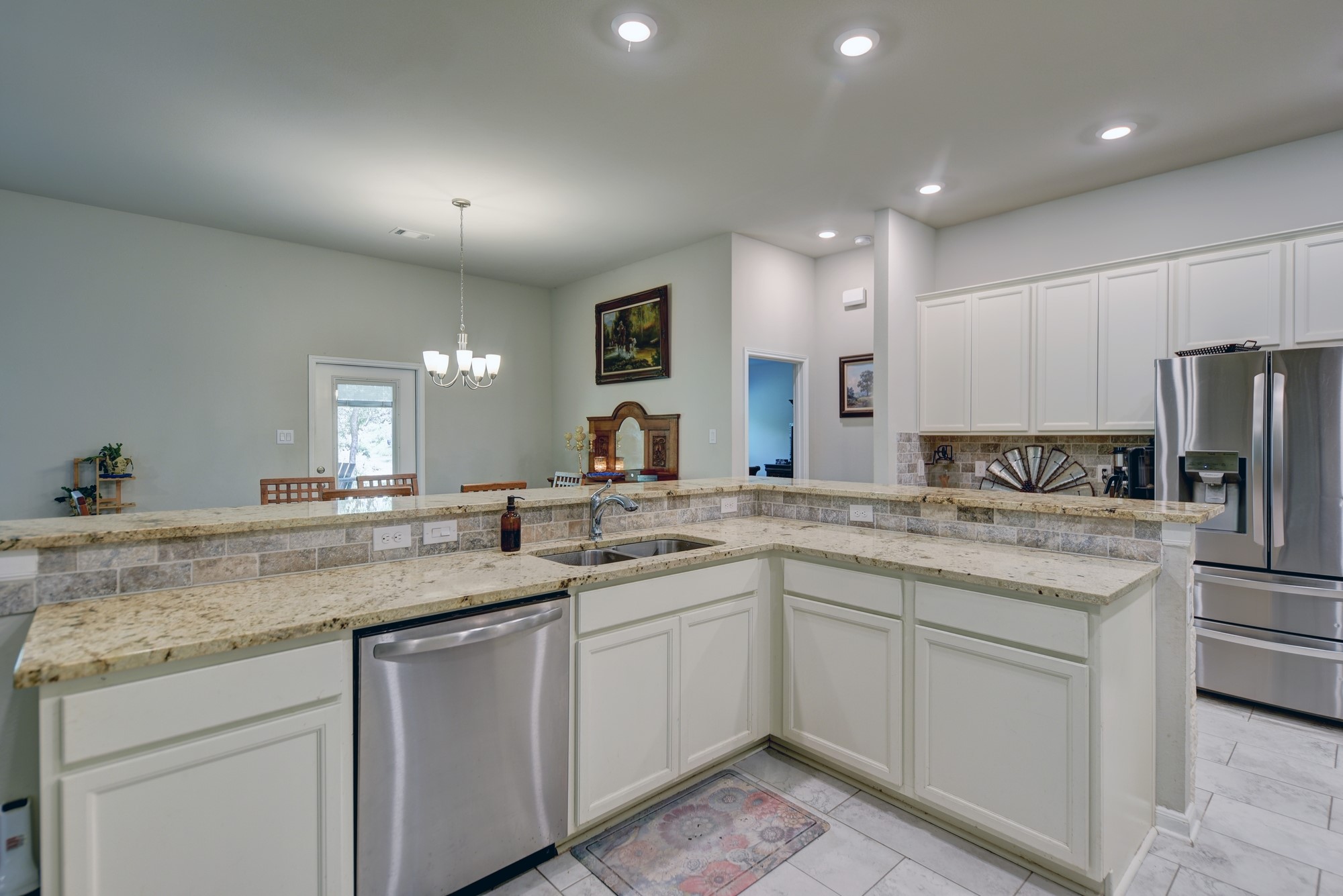 2612 Tiemann Road New Ulm, TX 78950 - Photo 16 of 39 a kitchen with a sink stove and refrigerator