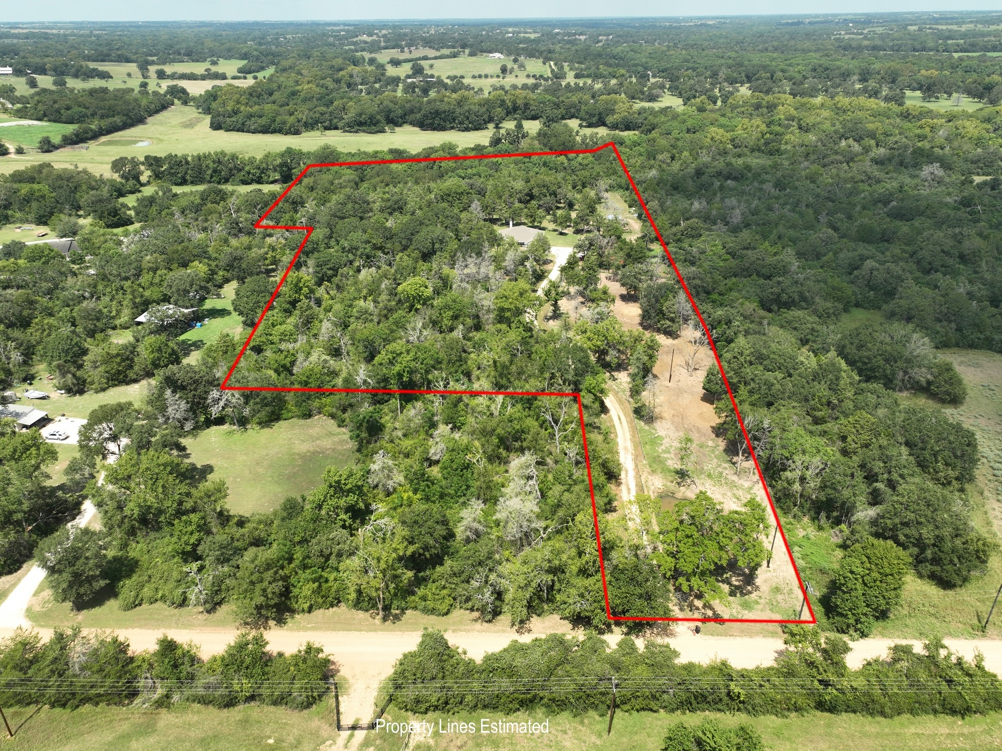 2612 Tiemann Road New Ulm, TX 78950 - Photo 2 of 39 an aerial view of residential houses with outdoor space and trees