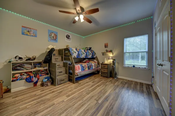 a bedroom with furniture and a window