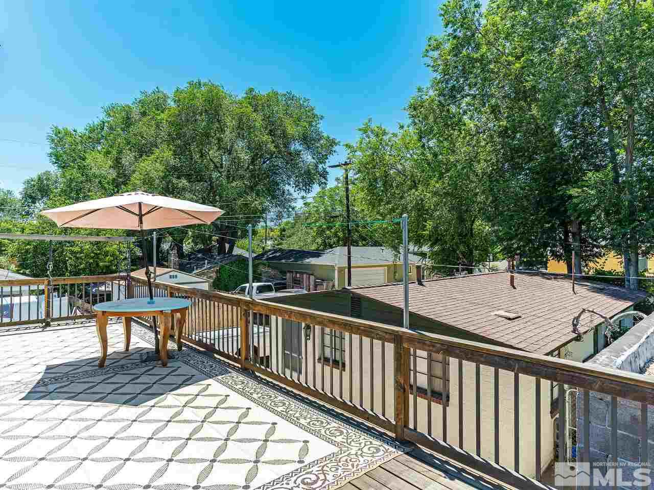 320 Caliente Street Reno, NV 89509 - Photo 2 of 17 a view of a chairs and table under an umbrella