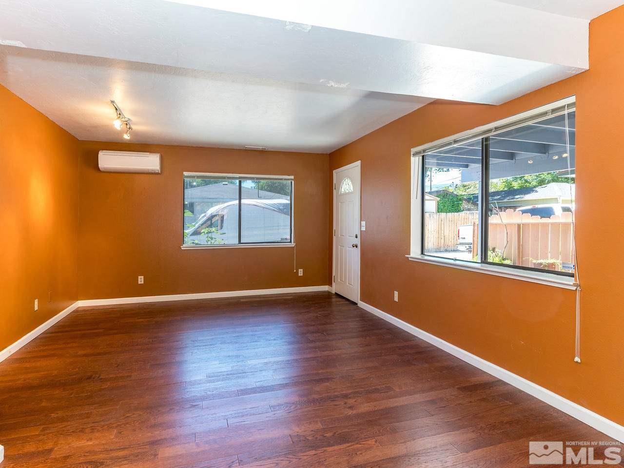 320 Caliente Street Reno, NV 89509 - Photo 7 of 17 a view of an empty room with wooden floor and a window