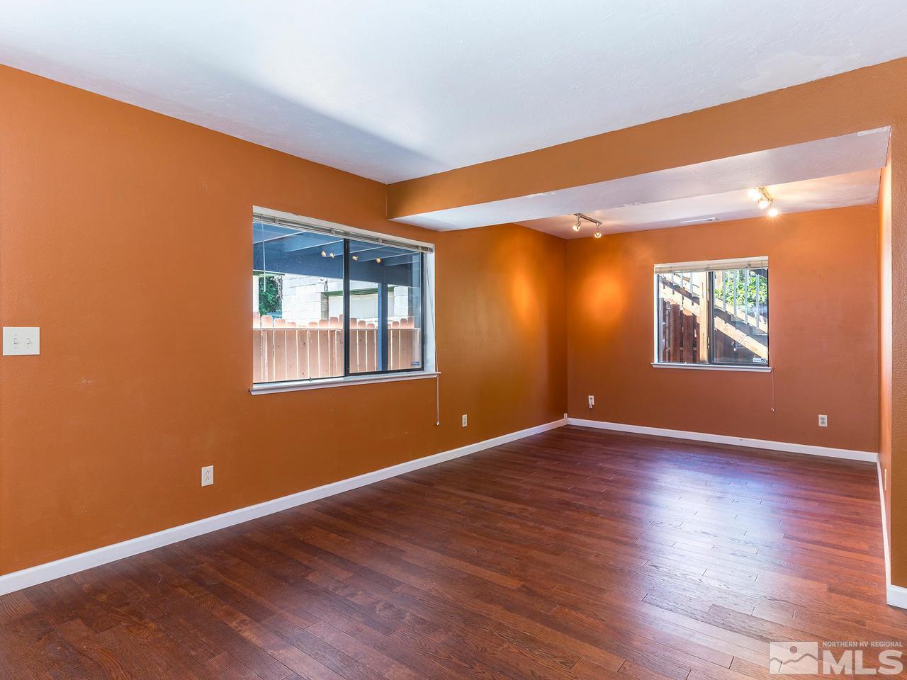320 Caliente Street Reno, NV 89509 - Photo 8 of 17 a view of an empty room with wooden floor and a window