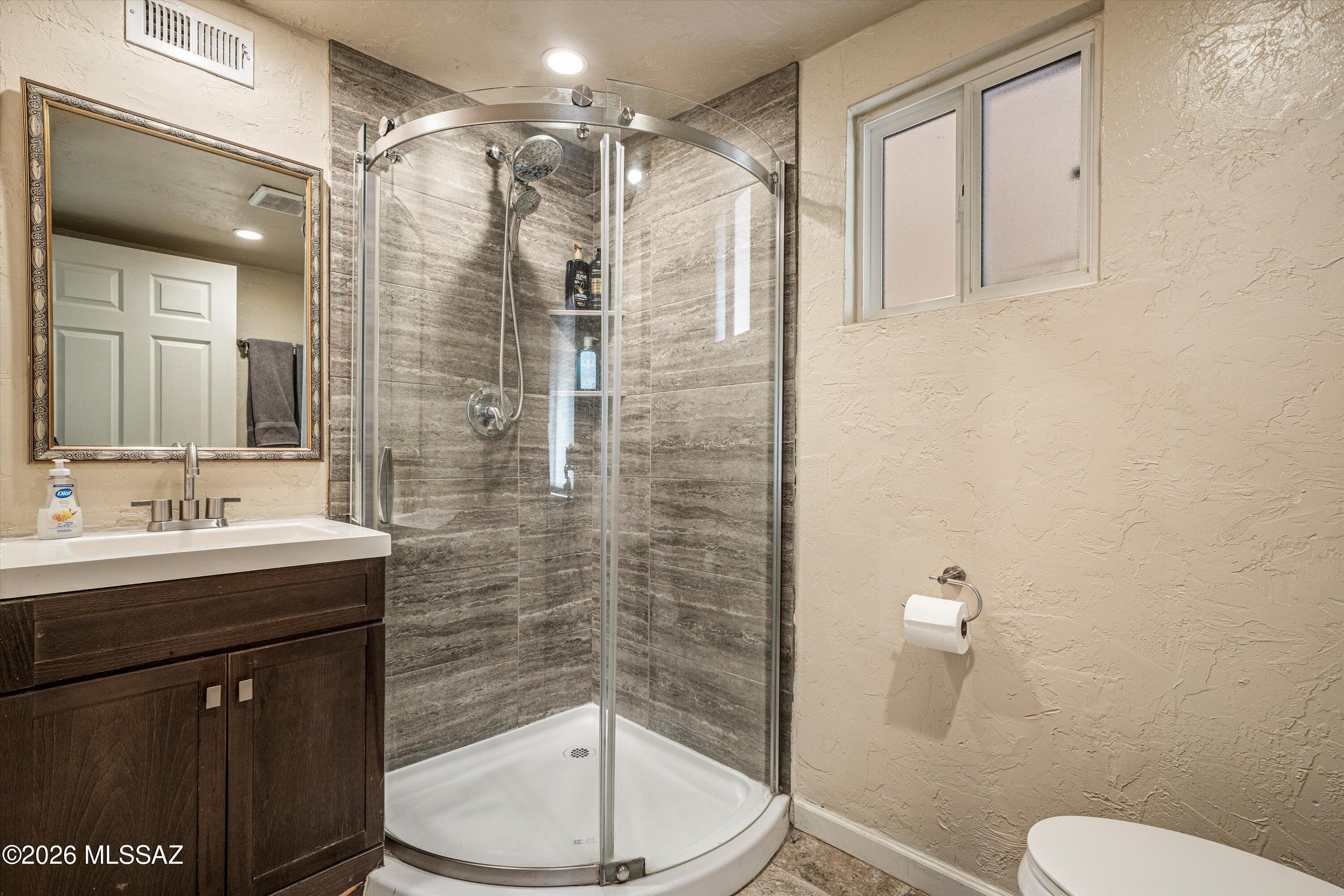 2619 East Prince Road Tucson, AZ 85716 - Photo 48 of 50 a bathroom with a sink a toilet and shower