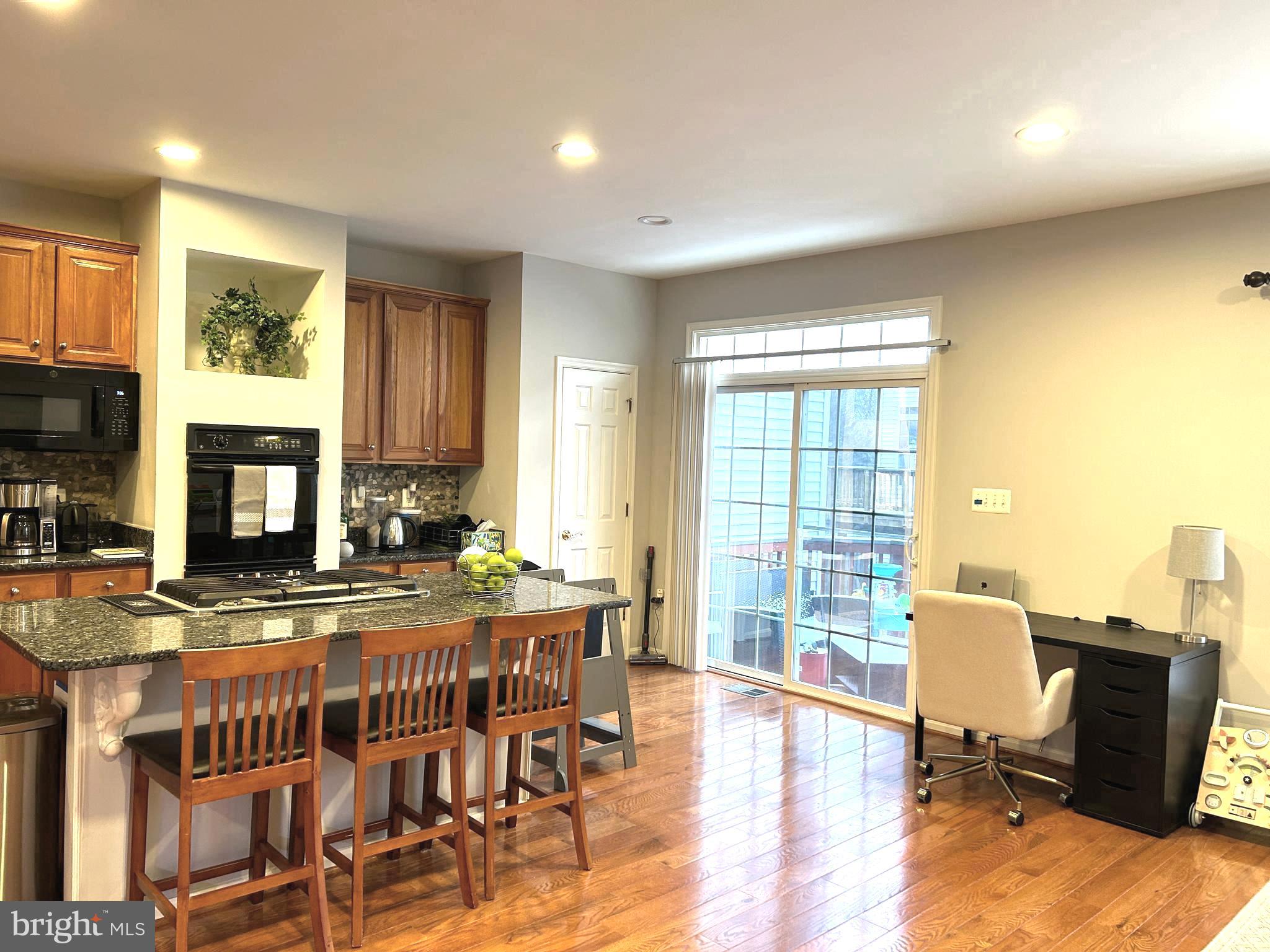 7358 Bloomington Court Springfield, VA 22150 - Photo 11 of 69 a view of a dining room with furniture window and wooden floor