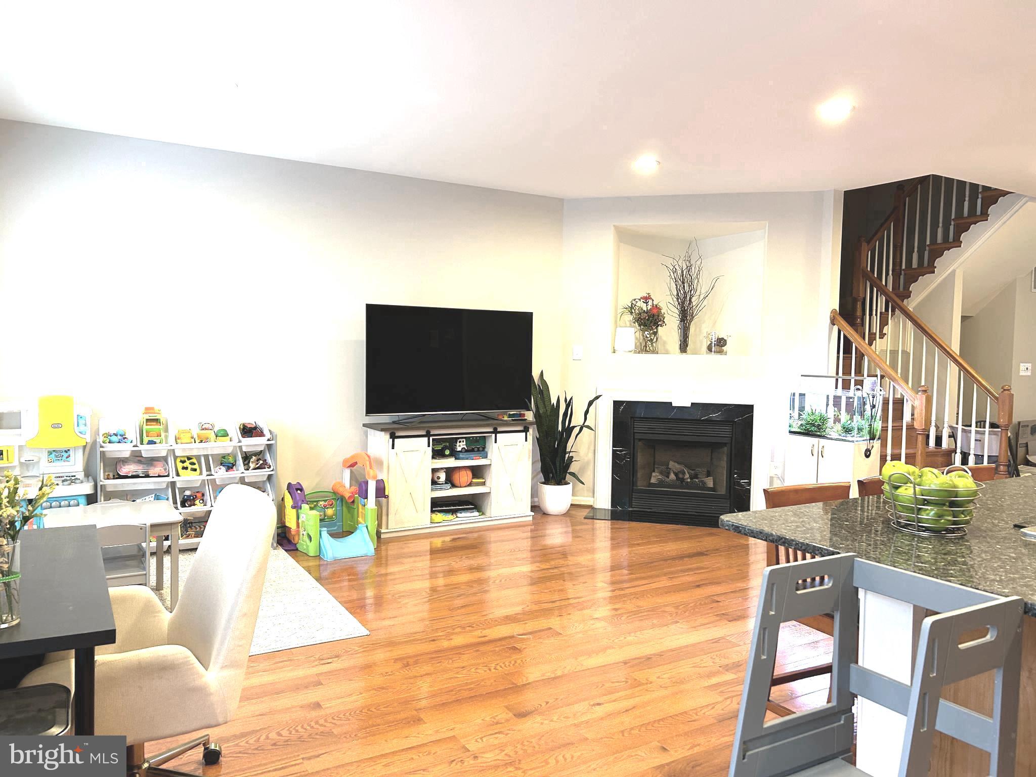7358 Bloomington Court Springfield, VA 22150 - Photo 16 of 69 a living room with furniture and a flat screen tv