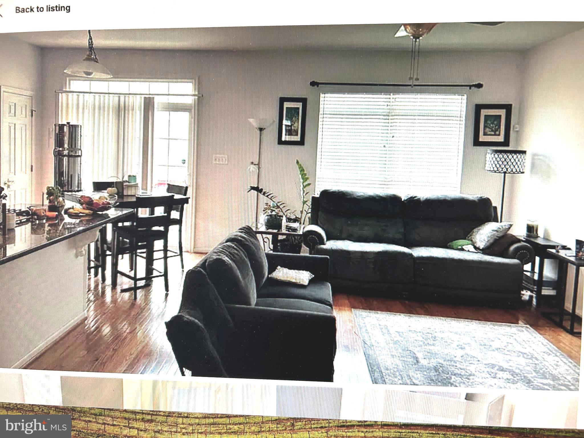 7358 Bloomington Court Springfield, VA 22150 - Photo 17 of 69 a living room with furniture and a large window