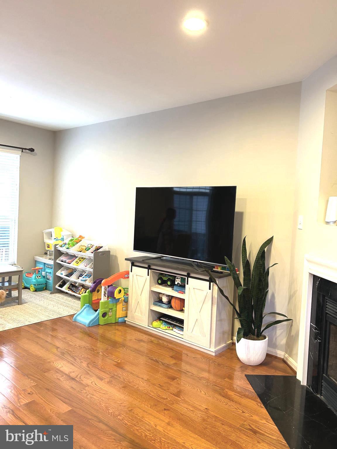 7358 Bloomington Court Springfield, VA 22150 - Photo 18 of 69 a bedroom with a bed and flat screen tv