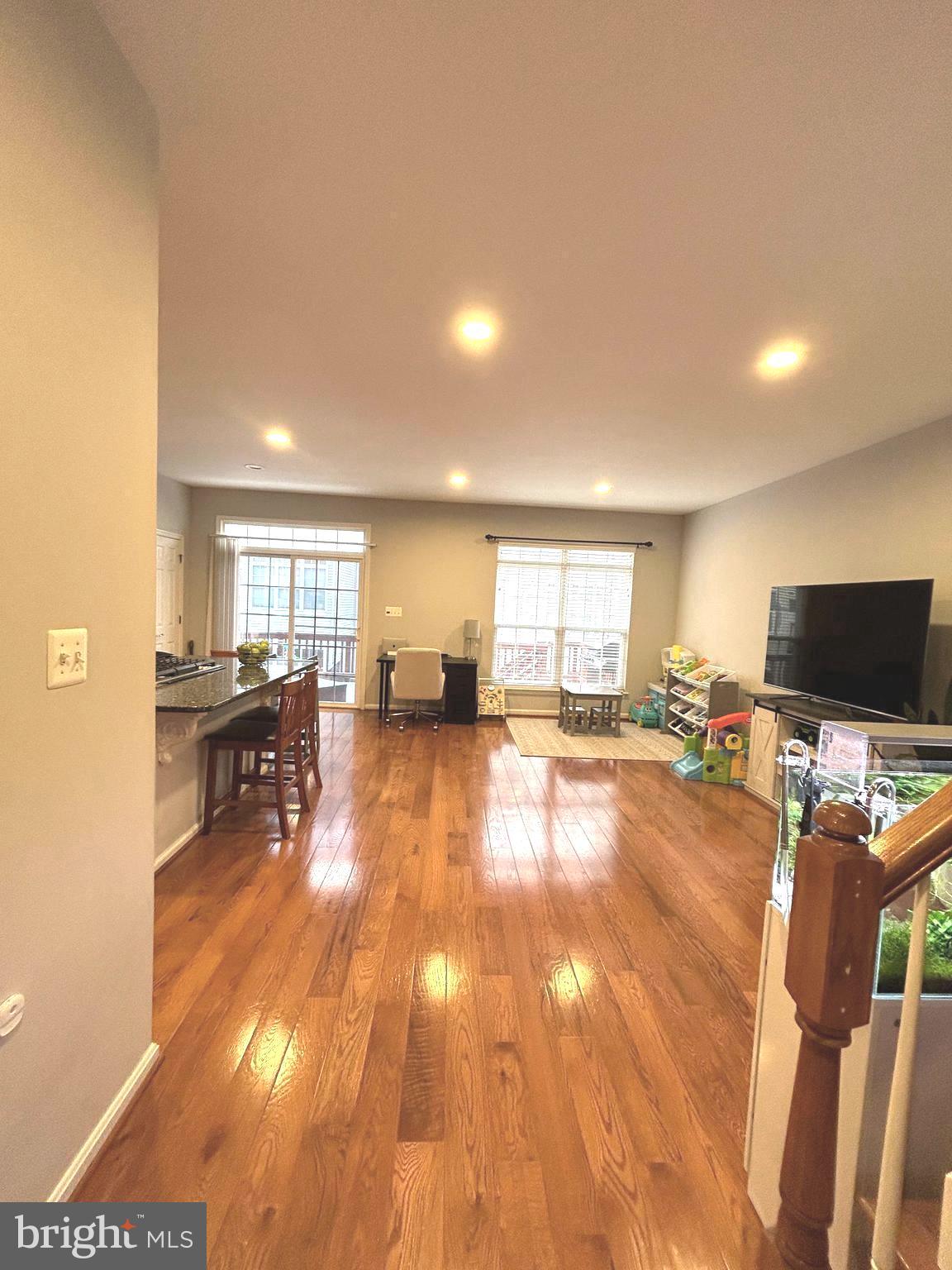 7358 Bloomington Court Springfield, VA 22150 - Photo 22 of 69 a living room with furniture and a flat screen tv