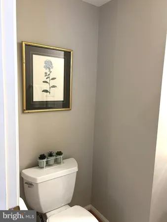 a bedroom with a bed and a night stand