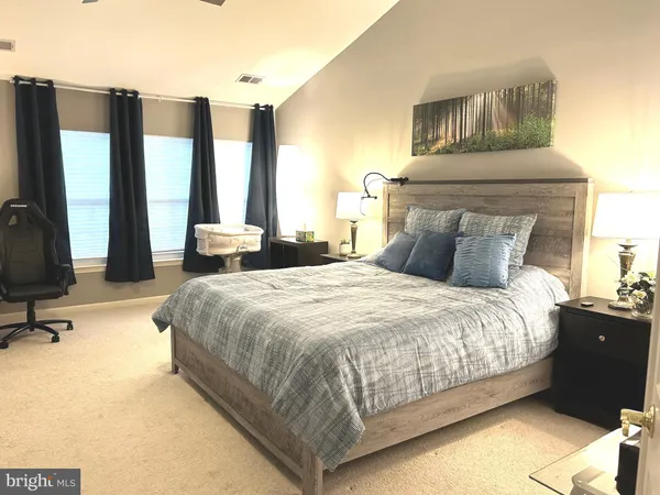 a view of workspace with wooden floor windows