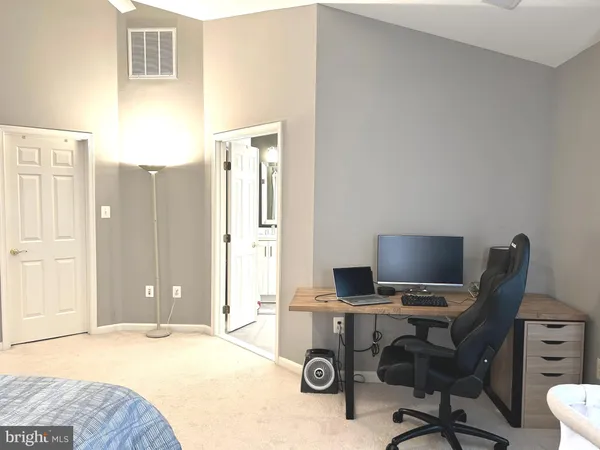 a bathroom with a sink mirror vanity and toilet
