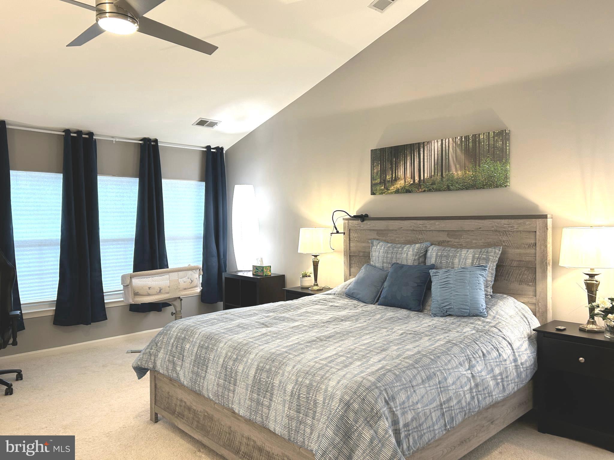 7358 Bloomington Court Springfield, VA 22150 - Photo 46 of 69 a bedroom with a large bed and a large window