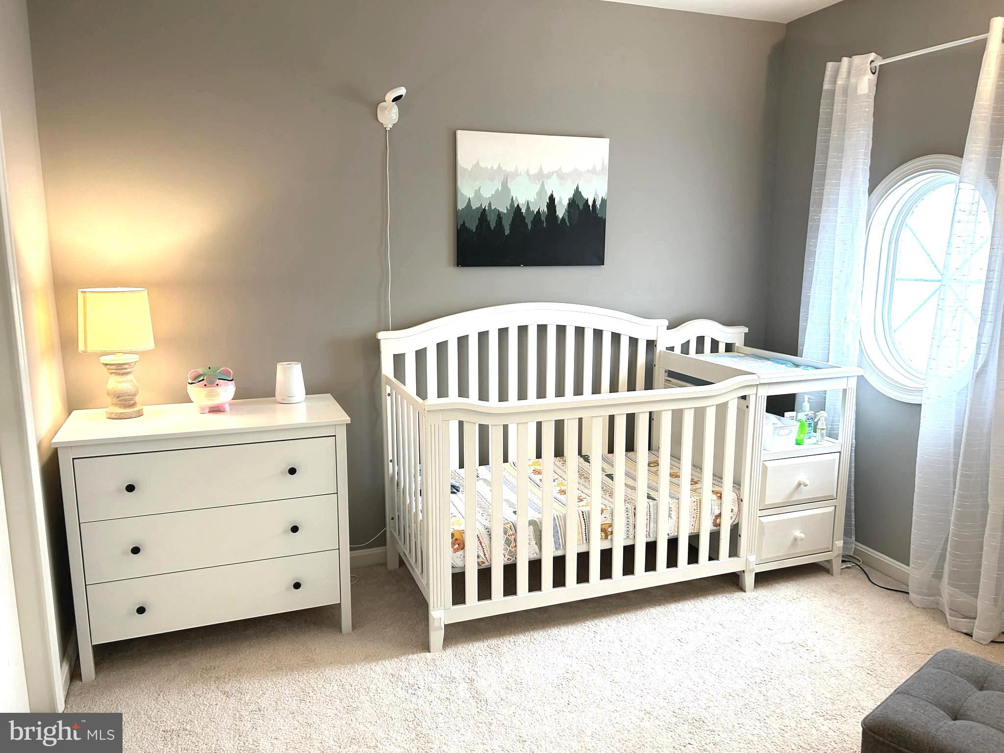 7358 Bloomington Court Springfield, VA 22150 - Photo 52 of 69 a bedroom with a bed and window