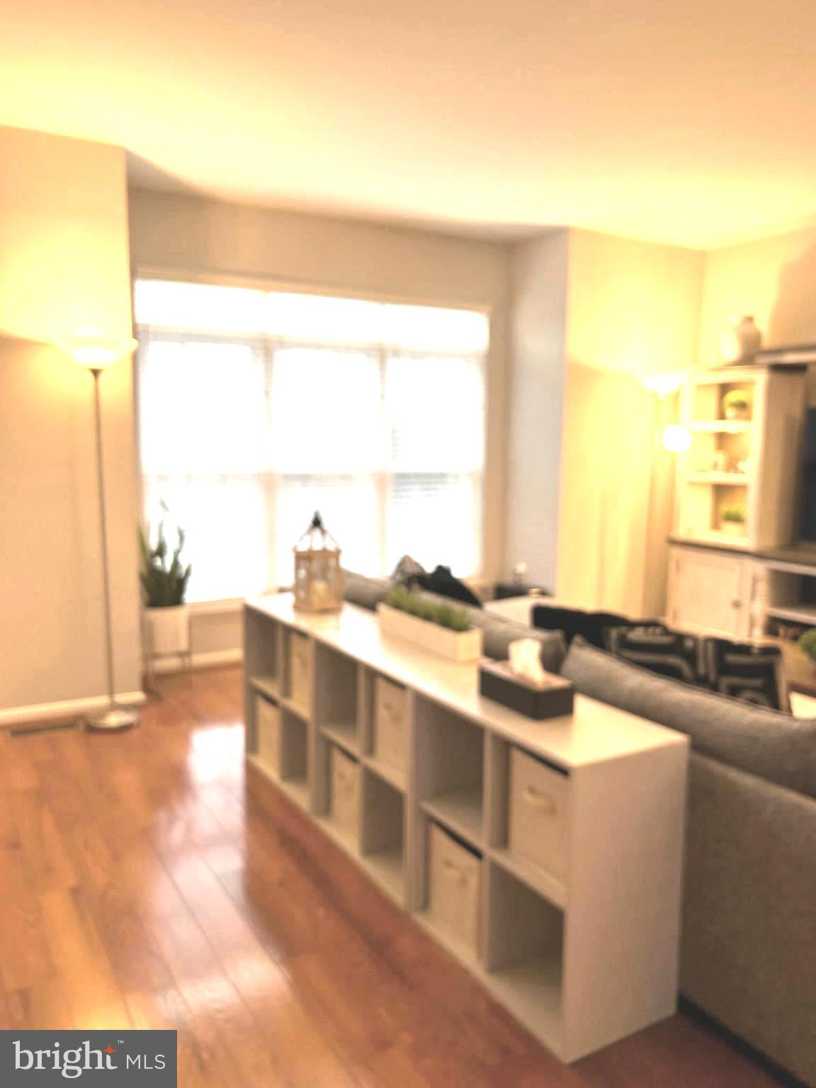 7358 Bloomington Court Springfield, VA 22150 - Photo 8 of 69 a view of a living room with furniture and a large window
