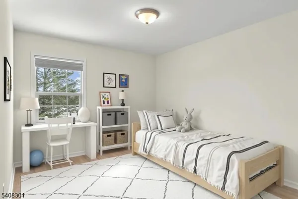 a bedroom with a bed and a cabinets