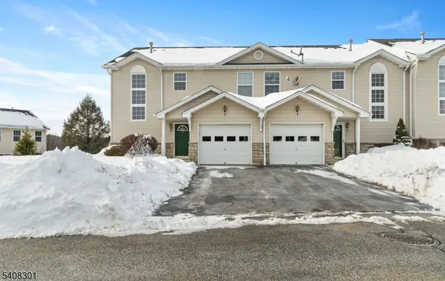 a view of a white house with a outdoor space