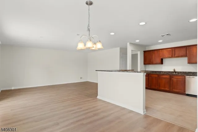 a view of counter top space and stainless steel appliances