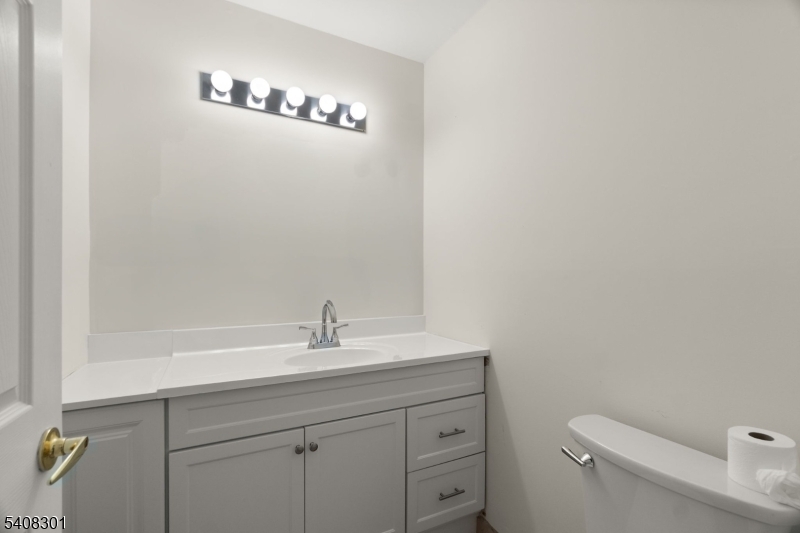 19 Winding Way Hamburg, NJ 07419 - Photo 7 of 16 a bathroom with a sink a toilet and a mirror