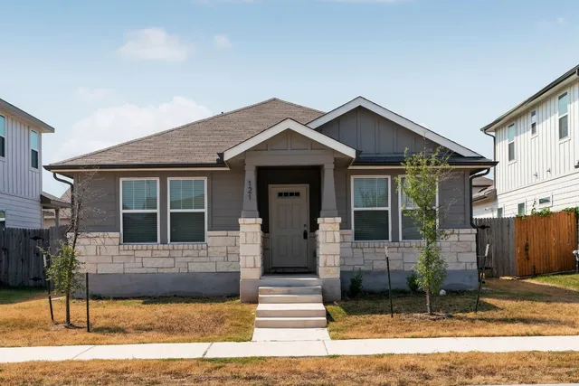 a front view of a house with a garage