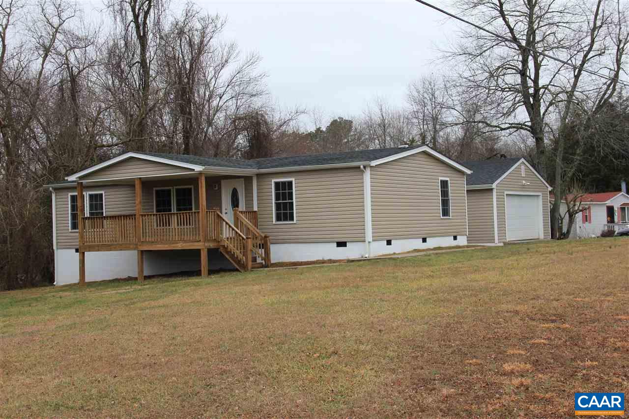 15 Begonia Road Ruckersville, VA 22968 - Photo 1 of 23 a front view of a house with a garden and yard