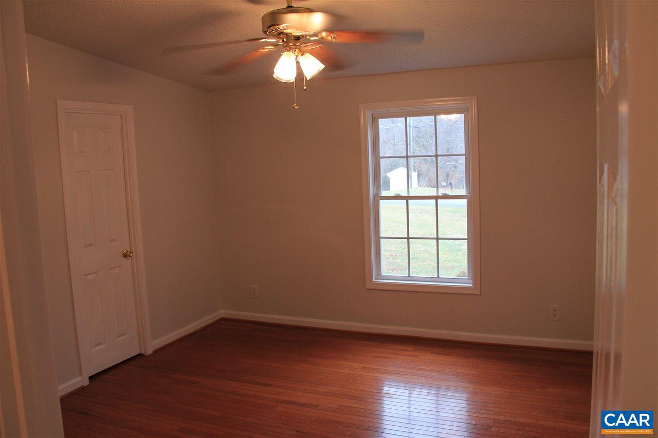 15 Begonia Road Ruckersville, VA 22968 - Photo 5 of 23 an empty room with wooden floor closet and windows
