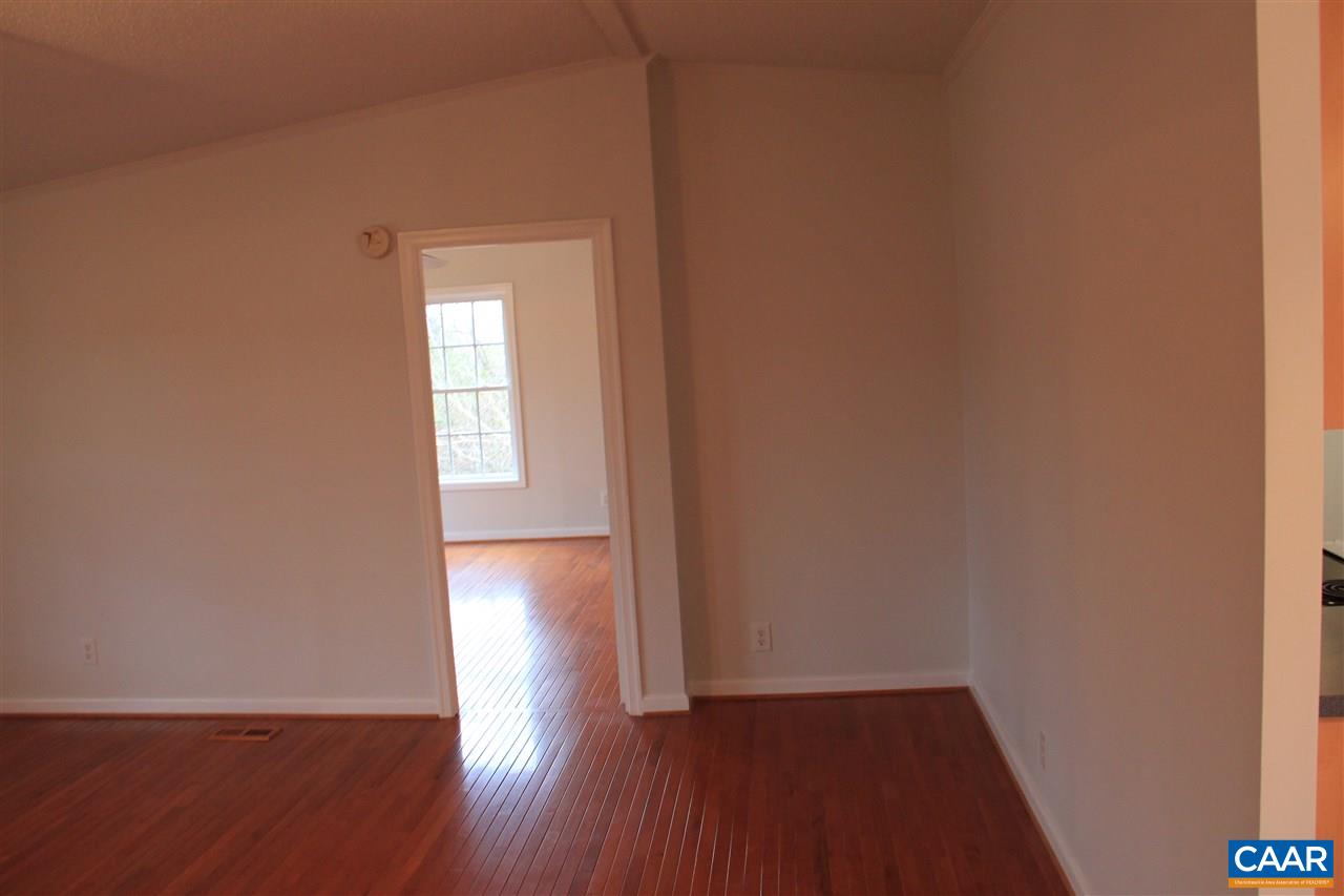 15 Begonia Road Ruckersville, VA 22968 - Photo 6 of 23 a view of empty room with wooden floor and fan