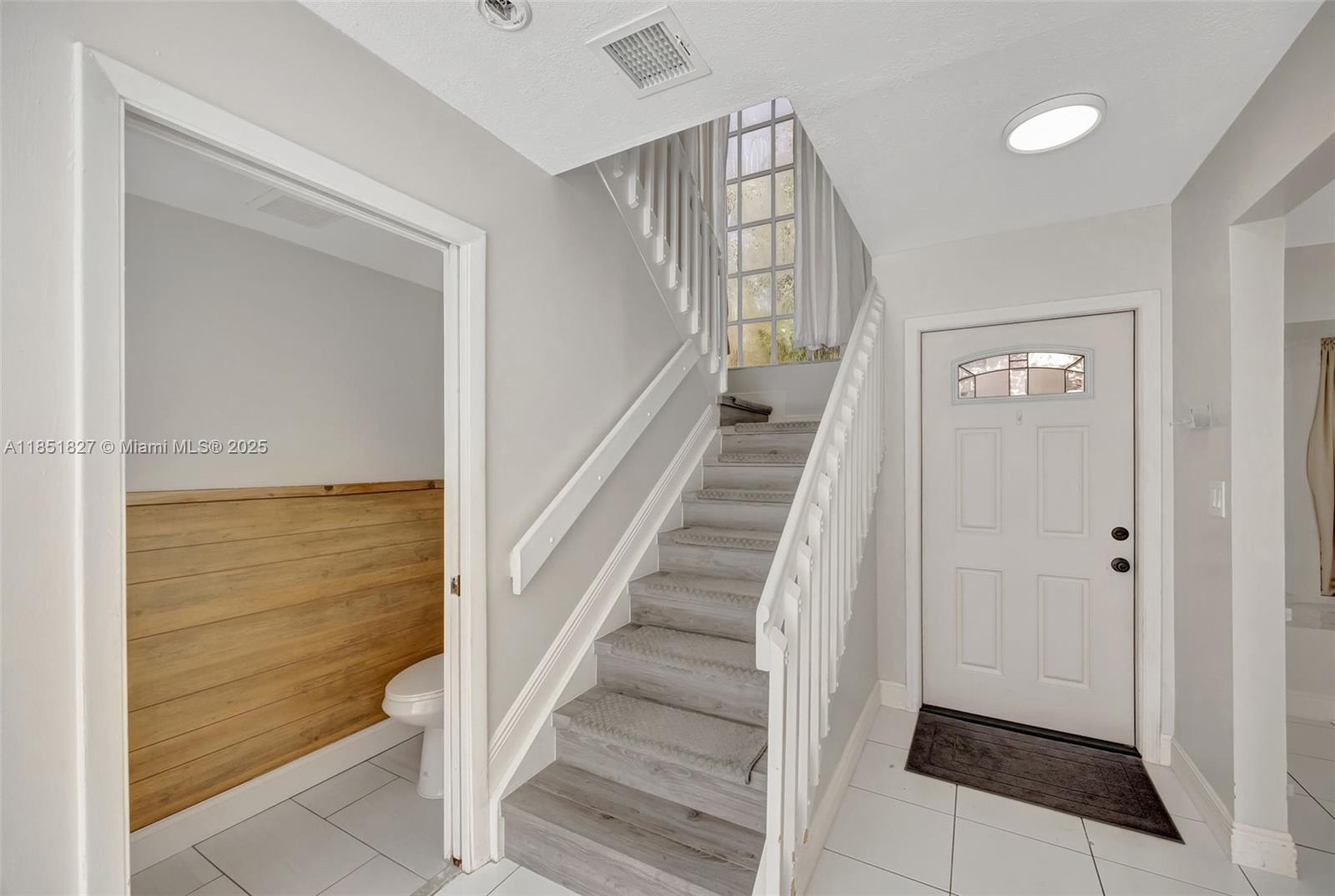 15224 Southwest 111th Street Miami, FL 33196 - Photo 15 of 27 a view of entryway with wooden floor and stairs
