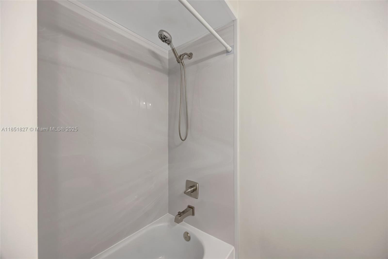 15224 Southwest 111th Street Miami, FL 33196 - Photo 21 of 27 a bathroom with a bathtub