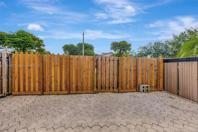 a view of outdoor space with wooden fence